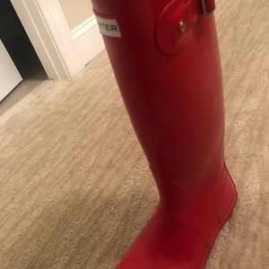 Tall red Hunter rain boots